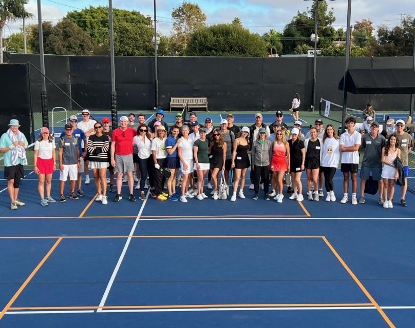 Group photo of all Pickleball players on the tennis court at Griffin Club Los Angeles